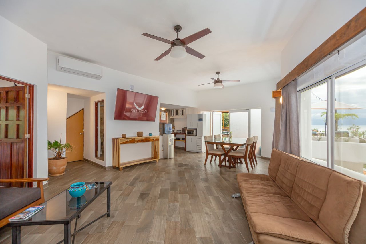 Spacious living area of the Penthouse with living room, dining area and kitchenette