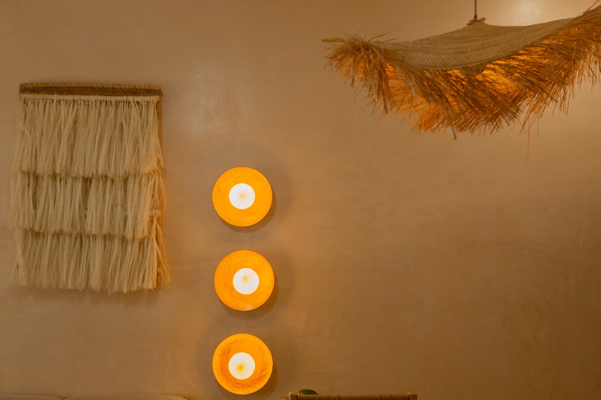 Details of natural fibers and warm lighting in Amaca Residence