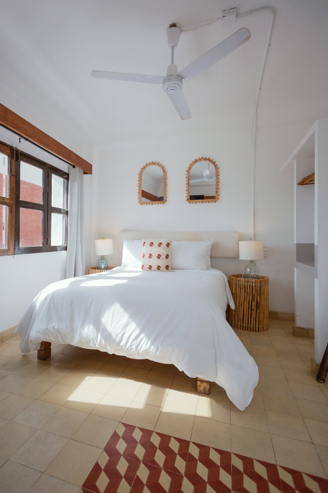 Double bed of the Deluxe Ocean View bathed in natural light